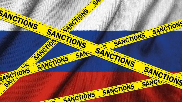 3d,Illustration,Of,A,Russia,Sanctions,Concept.,Yellow,Tape,With